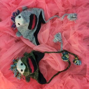 Funny faced wool hats with pom-poms